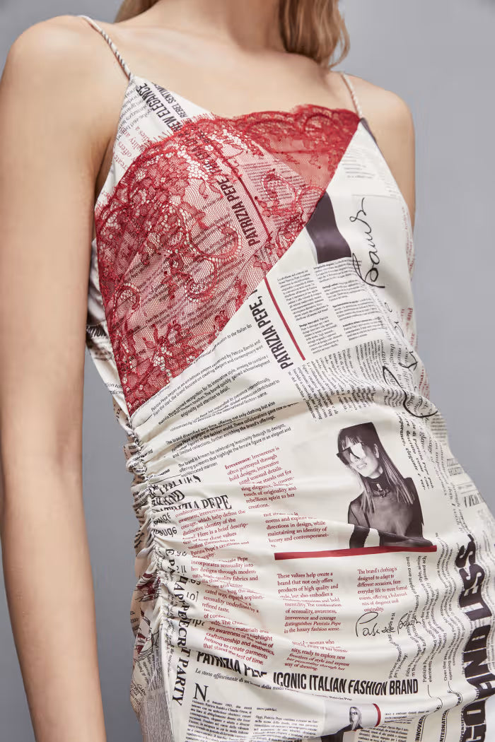 Newspaper dress with asymmetrical lace
