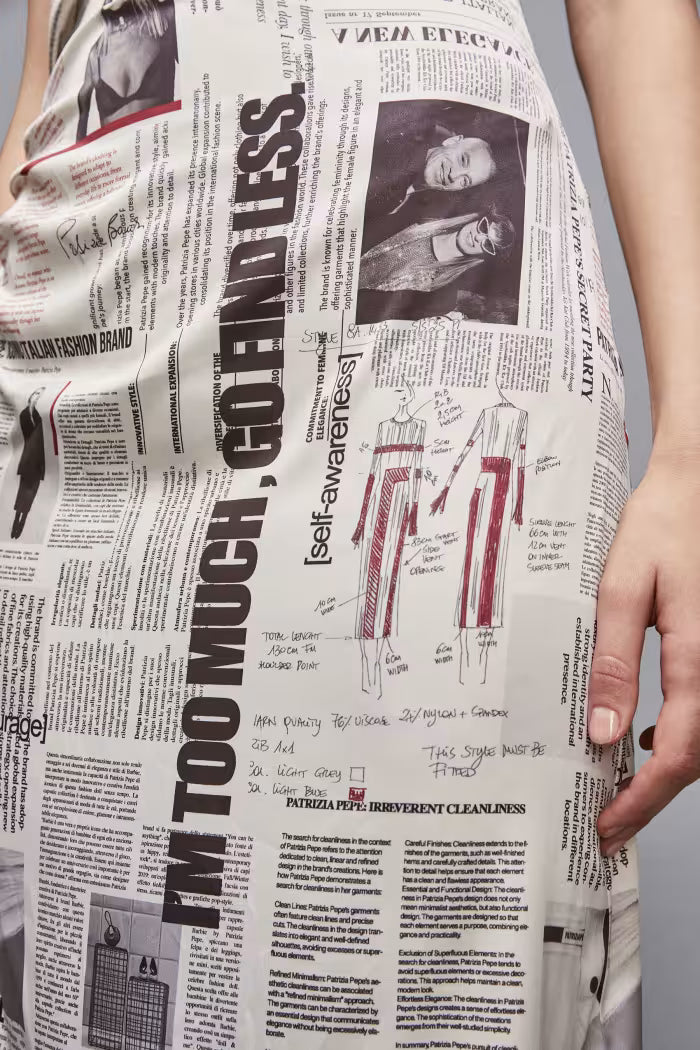 Newspaper dress with asymmetrical lace